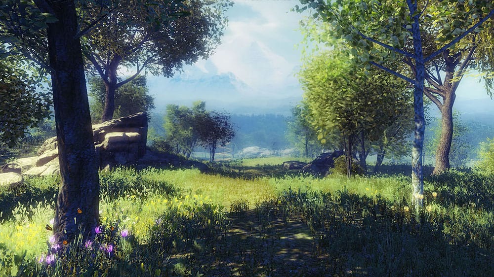 Tranquil VR nature scene with a grassy path through trees and mountains in the background.