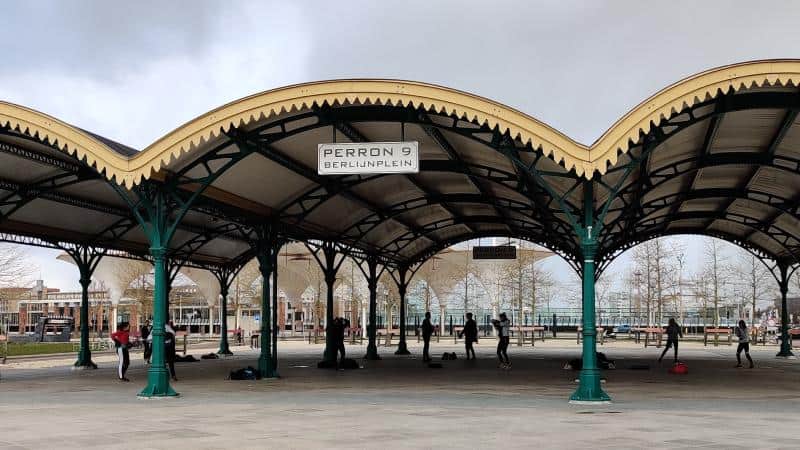 Outdoor VR activity taking place under the historic canopy of Rotterdam Centraal Station.